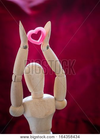 Still Life Wooden Puppet And Pink Heart.