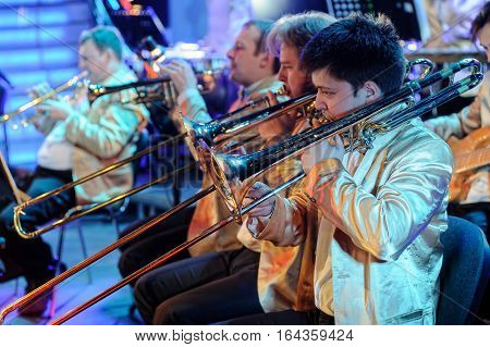 Tyumen, Russia - April 16, 2014: Competition of young performers the Song knows no limit in dramatic theater. Orchestra with musical instruments and performers during the performance
