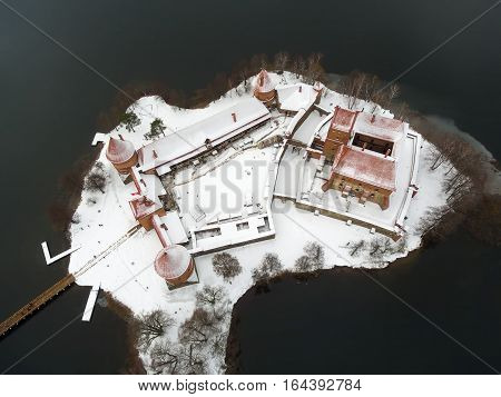 Trakai, Lithuania: aerial winter UAV top view, flat lay of gothic Island Castle. Historical residence in capital city of Grand Duchy of Lithuania, located in Galve lake