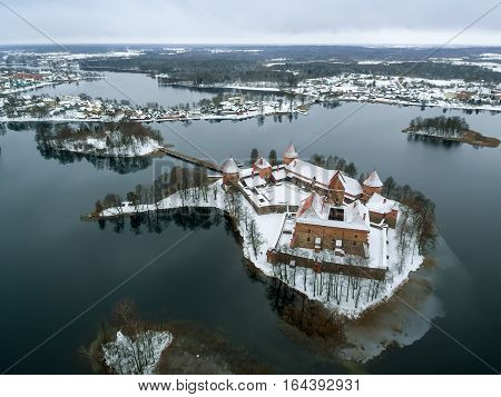 Trakai, Lithuania: aerial winter UAV top view, flat lay of gothic Island Castle. Historical residence in capital city of Grand Duchy of Lithuania, located in Galve lake