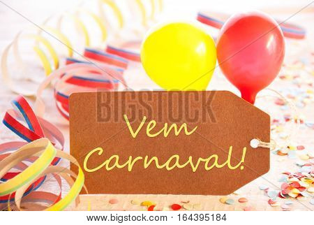 One Label With Spanish Text Vem Carneval Means Happy Carnival. Party Decoration Like Streamer, Confetti And Balloons. Wooden Background With Vintage, Retro Or Rustic Syle