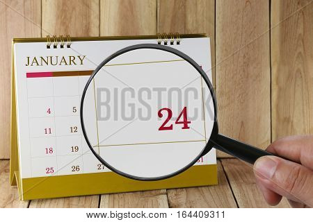 Magnifying Glass In Hand On Calendar You Can Look Twenty-four Day Of Monthfocus Number Twenty-four I