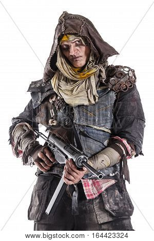 Nuclear post apocalypse life after doomsday concept. Grimy survivor with homemade weapons. Studio closeup portrait on white background