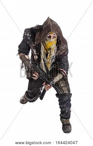 Nuclear post apocalypse life after doomsday concept. Grimy survivor with homemade weapons. Studio high angle portrait on white background