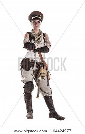 Nuclear post apocalypse life after doomsday concept. Grimy female survivor in tatters. Studio portrait on white background