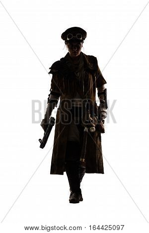 Nuclear post apocalypse life after doomsday concept. Grimy female survivor with homemade weapons. Studio portrait silhouette on white background