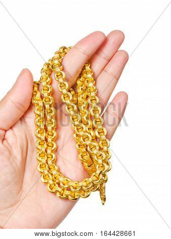 Golden necklace in left hand isolated on white background Saved clipping path.