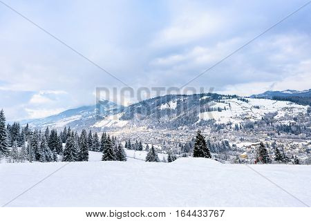 Beautiful mountains view with fog at resort town vatra dornei, bucovina, suceava, romania