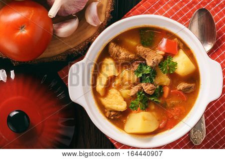 Hungarian soup goulash (bograch) with dumplings .