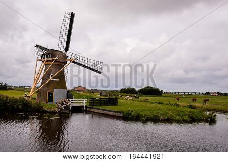 Classic Vintage Windmill In Holland