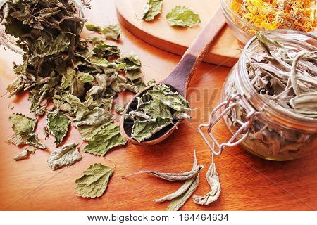 Dried herbs prepared for tea on table