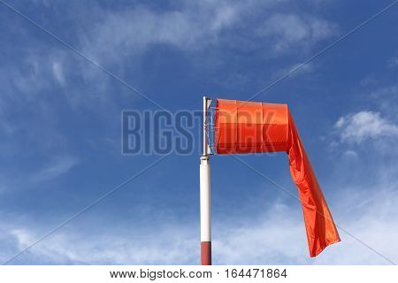 Wind sock of equipment check the wind blow direction in day time on blue sky background.