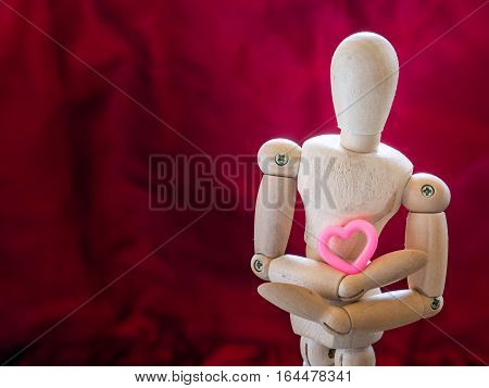 Still Life Wooden Puppet And Pink Heart.