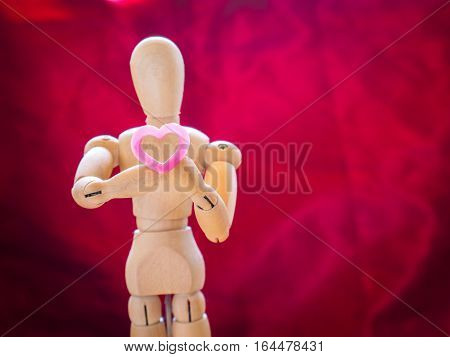 Still Life Wooden Puppet And Pink Heart.