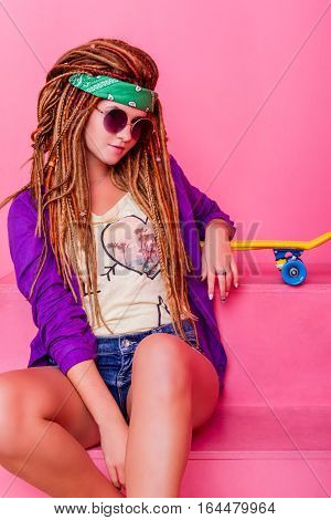 Portrait Of A Young Girl With Skateboard