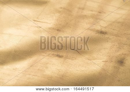 Gold texture with kinks and scratches abstract background. Golden background