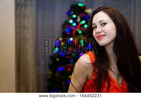 Young Brunette Girl In Red Dress Celebrating New Year