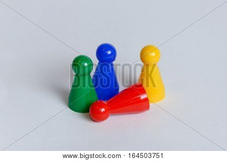 Four pawns with different color each in a group.