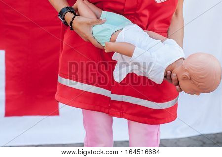 Demonstration Of First Aid Rebenkku With Choking