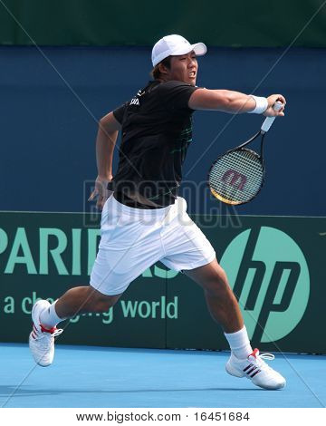 MELBOURNE, AUSTRALIA - 7 marzo: Hsin-Han Lee di Taipei cinese nella sua perdita Bernard Tomic di Aus