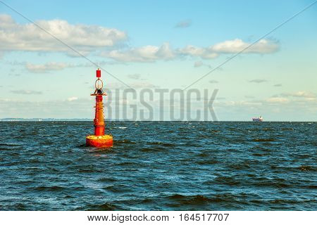 Navigation buoy at the edge of a fairway.