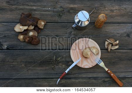 preparing mushrroms for food in old table