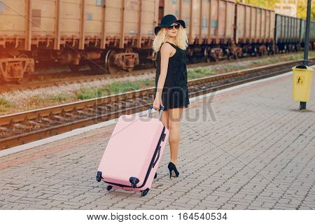 beautiful girl at raiway station. uses communication