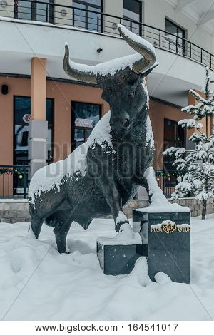 Rosa Khutor, Sochi, Russia, December 17 2016 Statue of Bull in the Snow