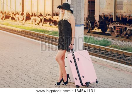 beautiful girl at raiway station. uses communication