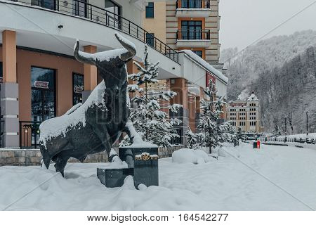 Rosa Khutor, Sochi, Russia, December 17 2016 Statue of Bull in the Snow