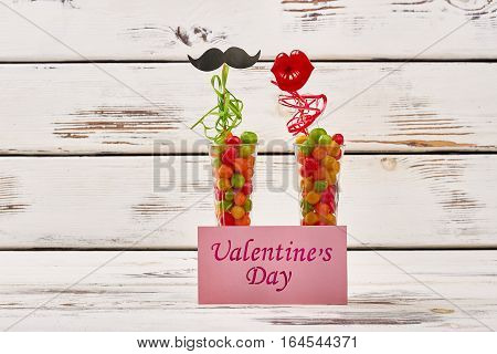 Valentine's Day card and props. Colorful streamer and candy pebbels. Mix of color and taste.