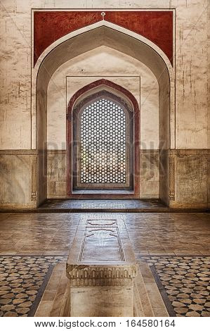 DELHI, INDIA - NOVEMBER 20, 2016: The interior of Humayan's Tomb in Delhi, India is richly decorated with inlaid stone. The building is a UNESCO World Heritage site.