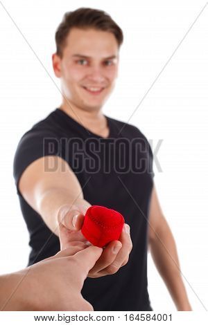 Picture of a young man giving an engagement ring to his girlfriend