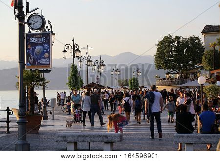 LAZISE. ITALY - MAY 5 2016: People on Promenade of Lazise at Garda Lake Italy