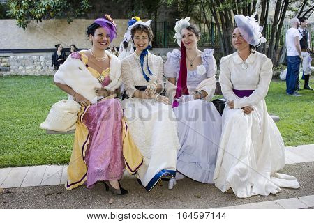 CAGLIARI, ITALY - May 29, 2016: Sunday at La Grande Jatte VIII Ed. At the Public Gardens - Sardinia - group of beautiful women in Victorian costumes