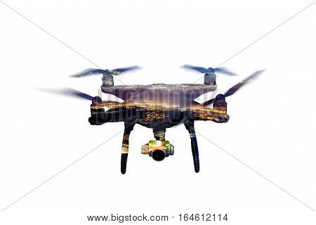 Double exposure. Close up of hovering drone taking pictures of illuminated city at night. Aerial view. Isolated.