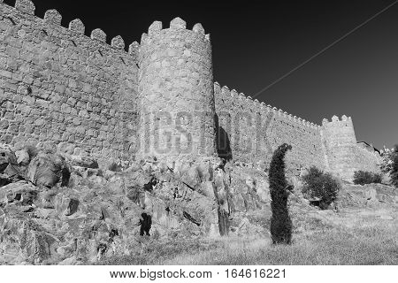 Avila (Castilla y Leon Spain): the famous medieval walls surrounding the city. Black and white