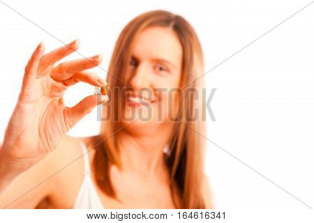 anti-ageing concept: woman in her forties with youth-pills