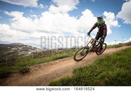 Mt Buller, Australia - January 4, 2017: Downhill mountain bike riders attempt the ABOM and International tracks on January 4, 2017 in Mt Buller, Australia