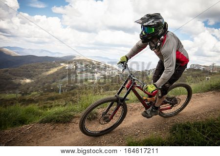 Mt Buller, Australia - January 4, 2017: Downhill mountain bike riders attempt the ABOM and International tracks on January 4, 2017 in Mt Buller, Australia