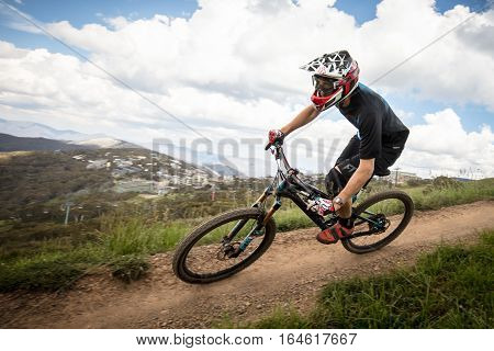 Mt Buller, Australia - January 4, 2017: Downhill mountain bike riders attempt the ABOM and International tracks on January 4, 2017 in Mt Buller, Australia