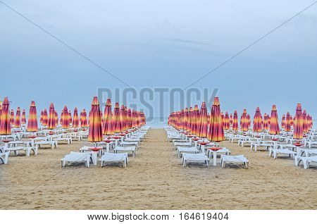 Albena, Bulgaria - June 13, 2016. The Black Sea Shore. Blue Sea Water, Clouds Sunset Sky, Beach Sand