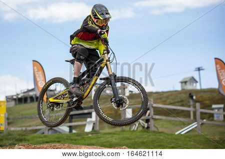Mt Buller, Australia - January 5, 2017: Downhill mountain bike riders attempt the ABOM and International tracks on January 5, 2017 in Mt Buller, Australia