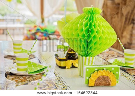 Party table for birthday with green decoration
