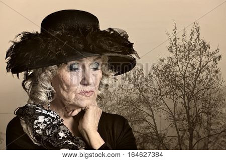 Portrait of a fashionable mature woman posing outdoors