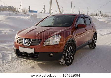 Nissan Qashqai in red color. This is crossover that combines modark design and compact hatchback refinement with functionality