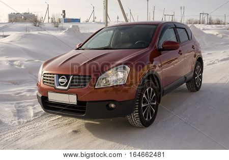 Nissan Qashqai in red color. This is crossover that combines modark design and compact hatchback refinement with functionality