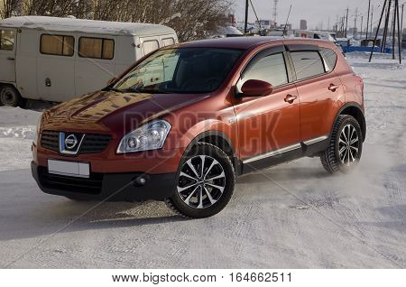 Nissan Qashqai in red color. This is crossover that combines modark design and compact hatchback refinement with functionality