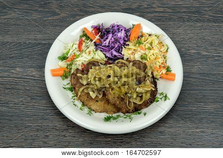 Polish traditional dish roasted meal meat with vegetables