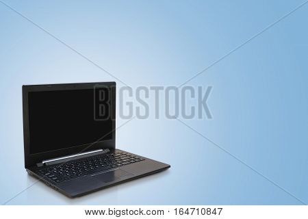 Black modern laptop and blue background. working